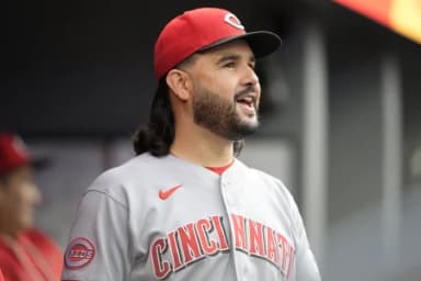Cincinnati Reds designated hitter Eugenio Suarez (28) smiles in the dugout during the ninth inning against the Toronto Blue Jays at Rogers Centre.