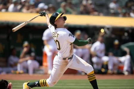 Oakland Athletics second baseman Zach Gelof (20) follows the flight of his RBI double against the Minnesota Twins during the seventh inning at Oakland-Alameda County Coliseum